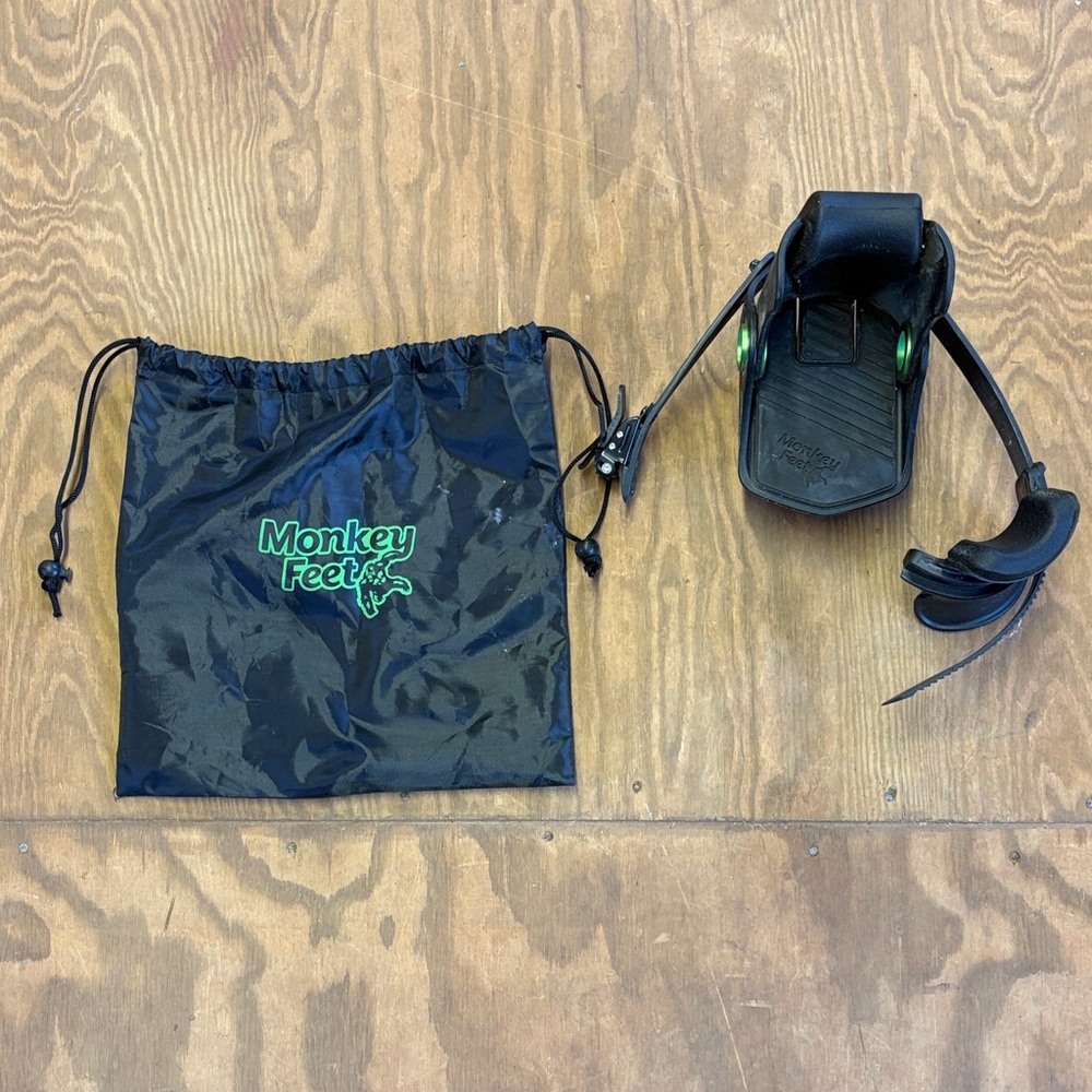 Monkey Feet Black Footstop with Green Logo and Drawstring Pouch